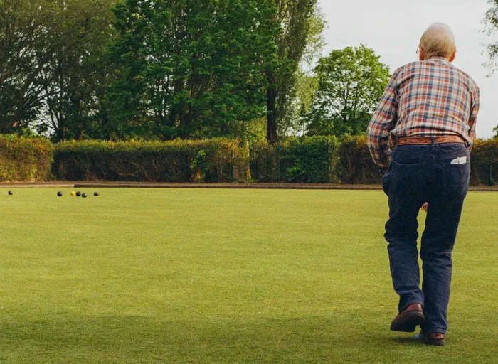 A crown green bowling game in progress at Hough Green Park Bowls Club